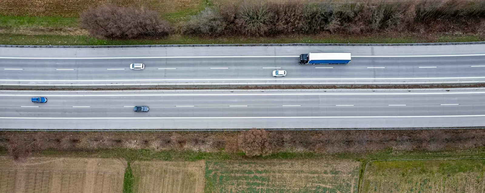 Aerial view of a truck on a multi-lane highway