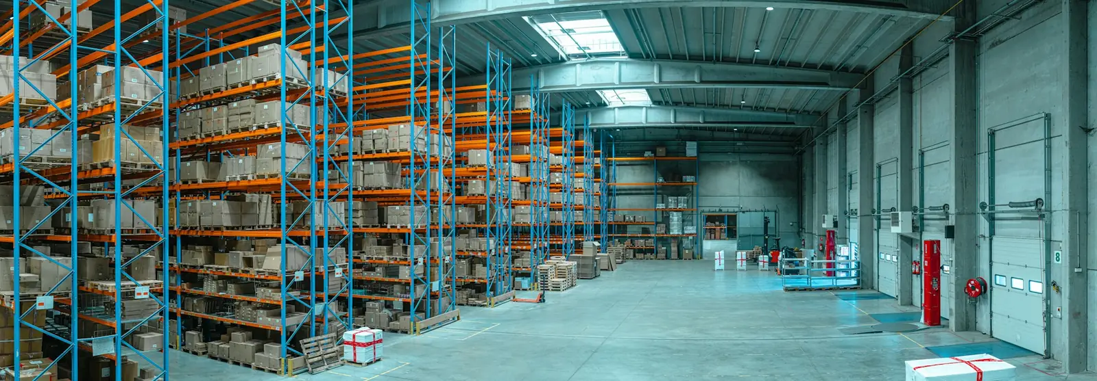 Warehouse interior with tall blue pallet racking